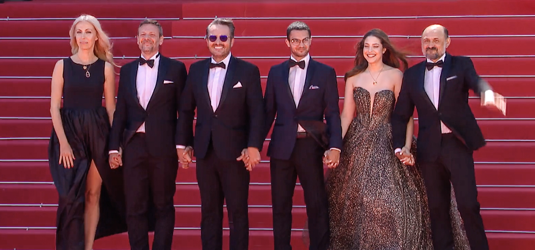 the cast of Trei Kilometrii Pan La Capital Lumia attending the premiere at Cannes Film Festival 2024